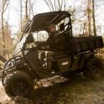 Hunter riding Cushman cart.