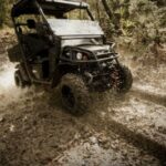 Cart driving through mud.