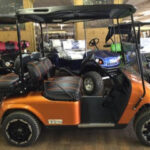 Orange custom golf cart.