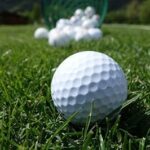 Golf balls on grass.