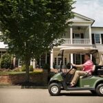 Msn driving cart through neighborhood.