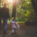 Dad and daughter hiking.