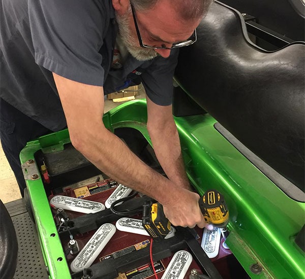 Garrett's mechanic working on golf cart.