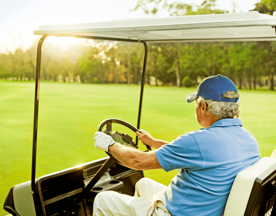 Senior man on a golf cart in a retirement community