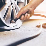 Technician is repairing flat tire