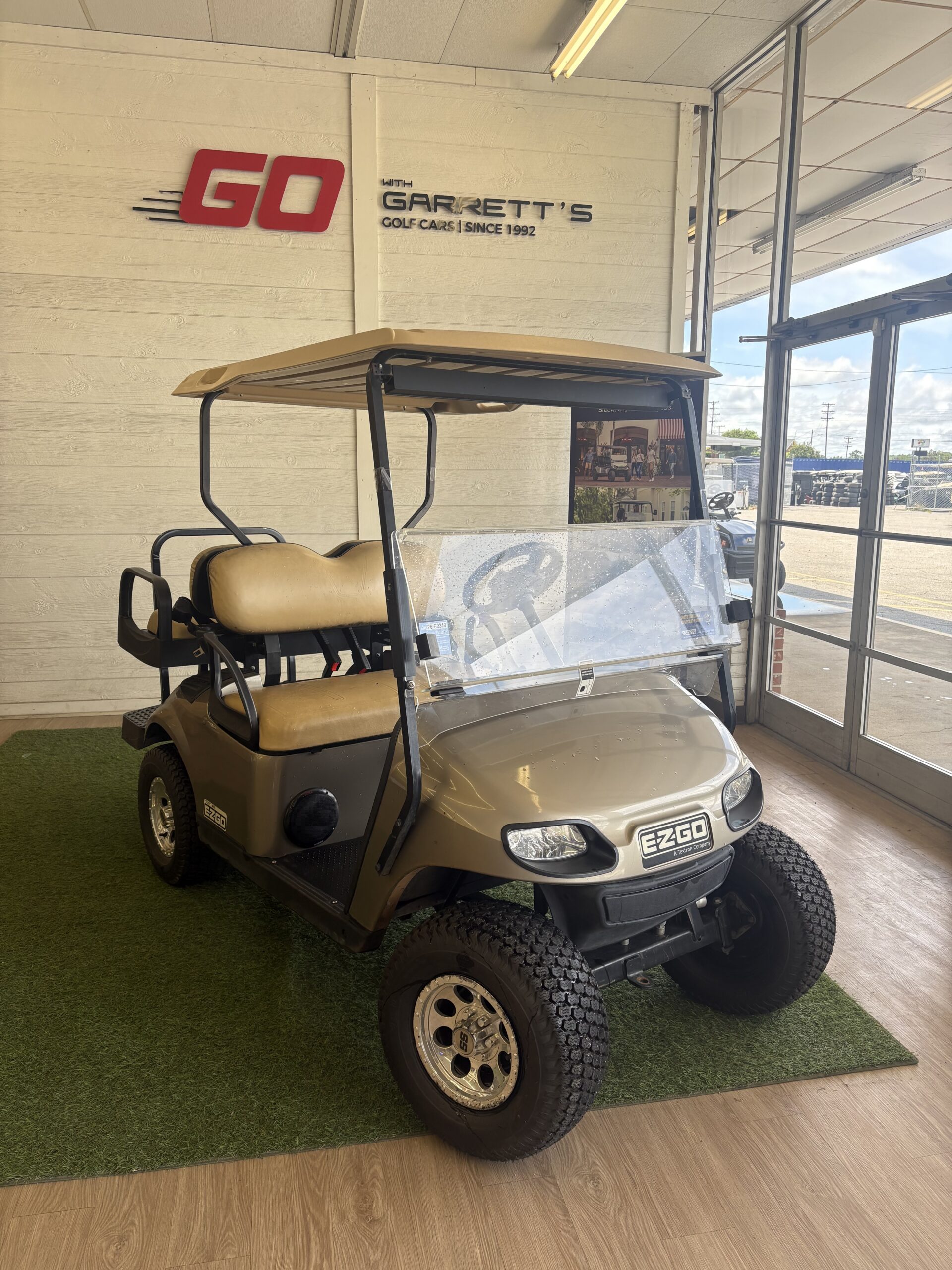 #312 - 2016 E-Z-GO TXT Lifted Champagne Gold