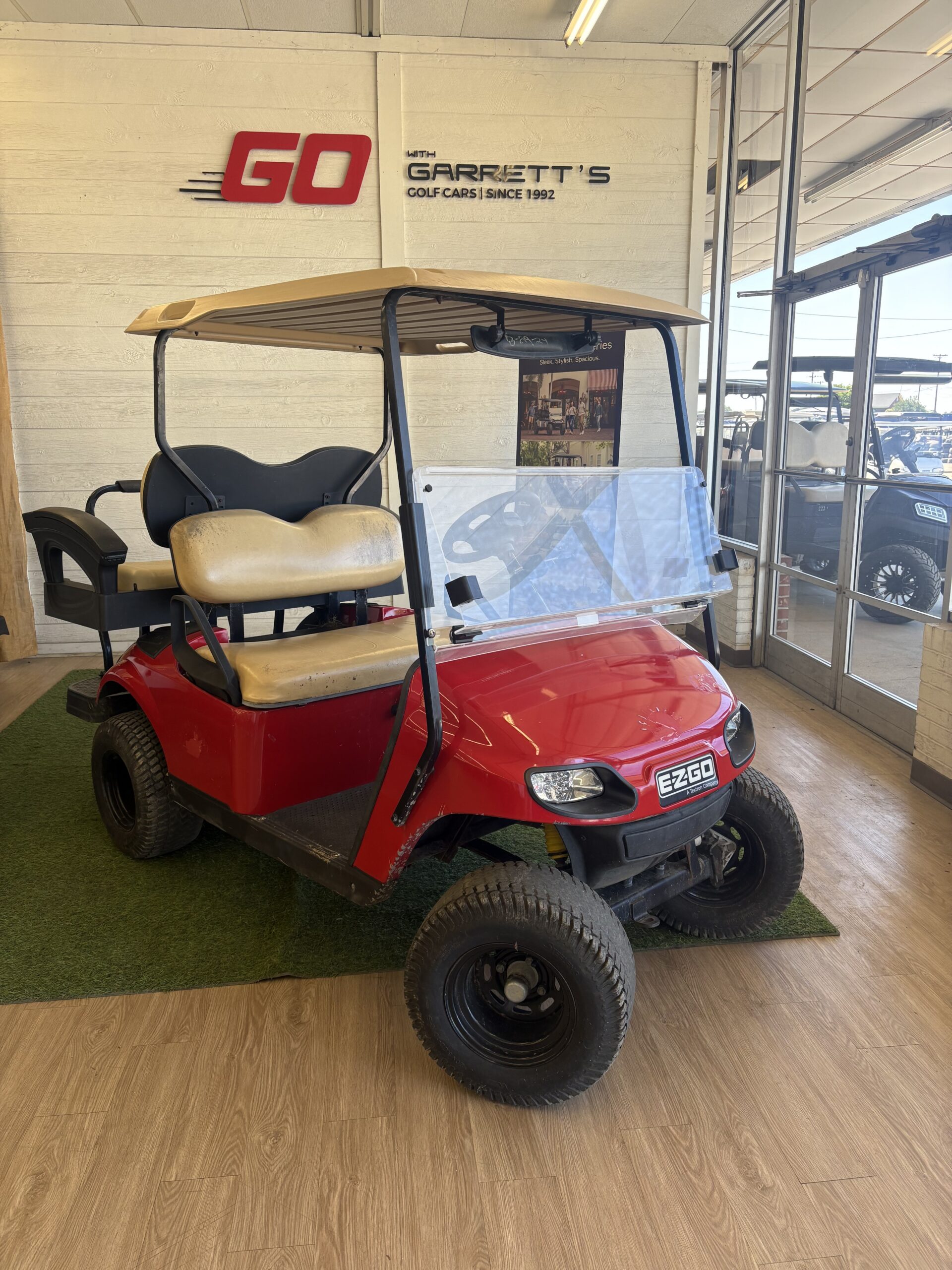 #309 - Lifted red E-Z-GO TXT GAS