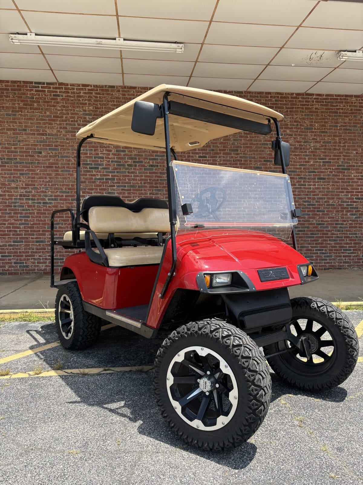 #301 - E-Z-GO Bright Red Lifted TXT 4 Passenger